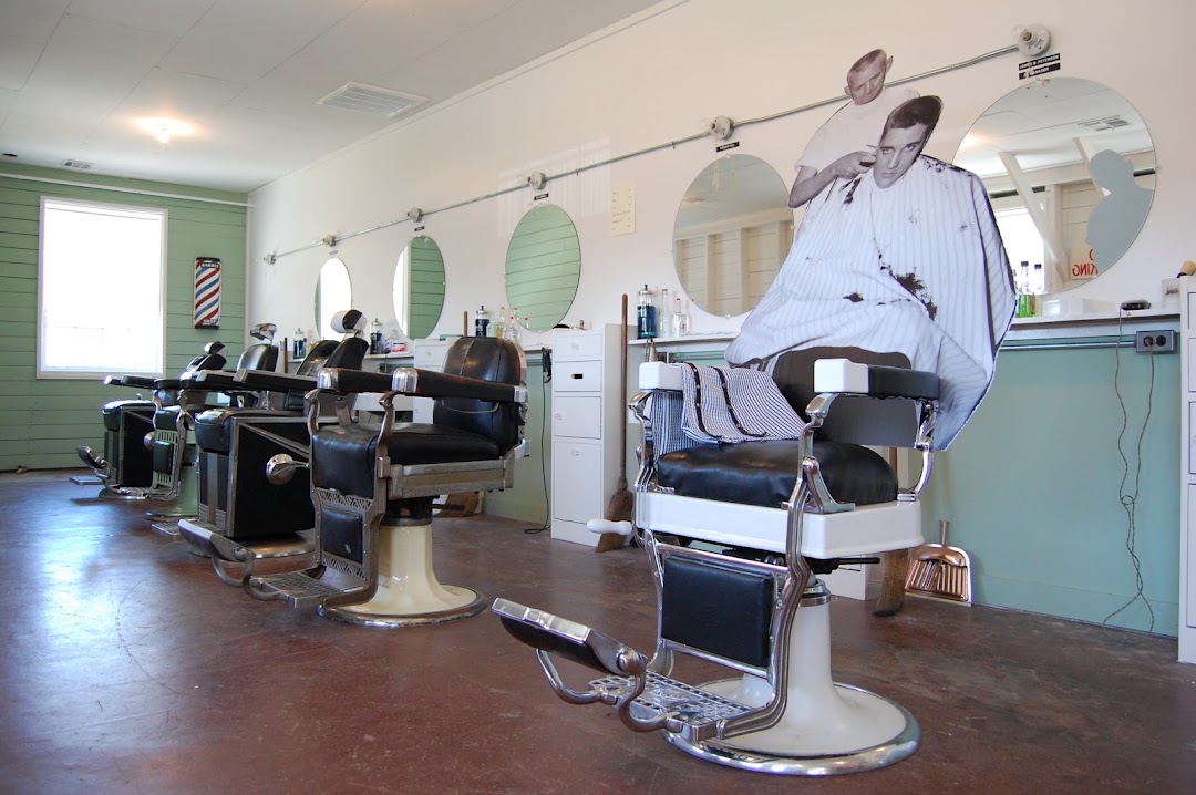 Inside Duff's Barber Shop: classic barber chairs, round mirrors, and vintage styling